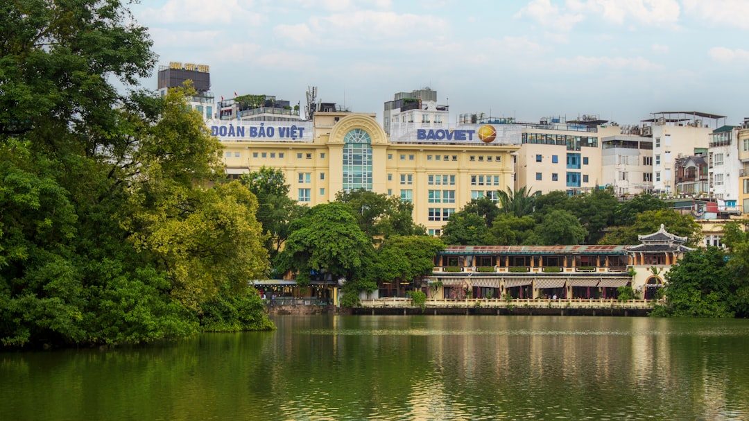 City buildings are seen across a lake.