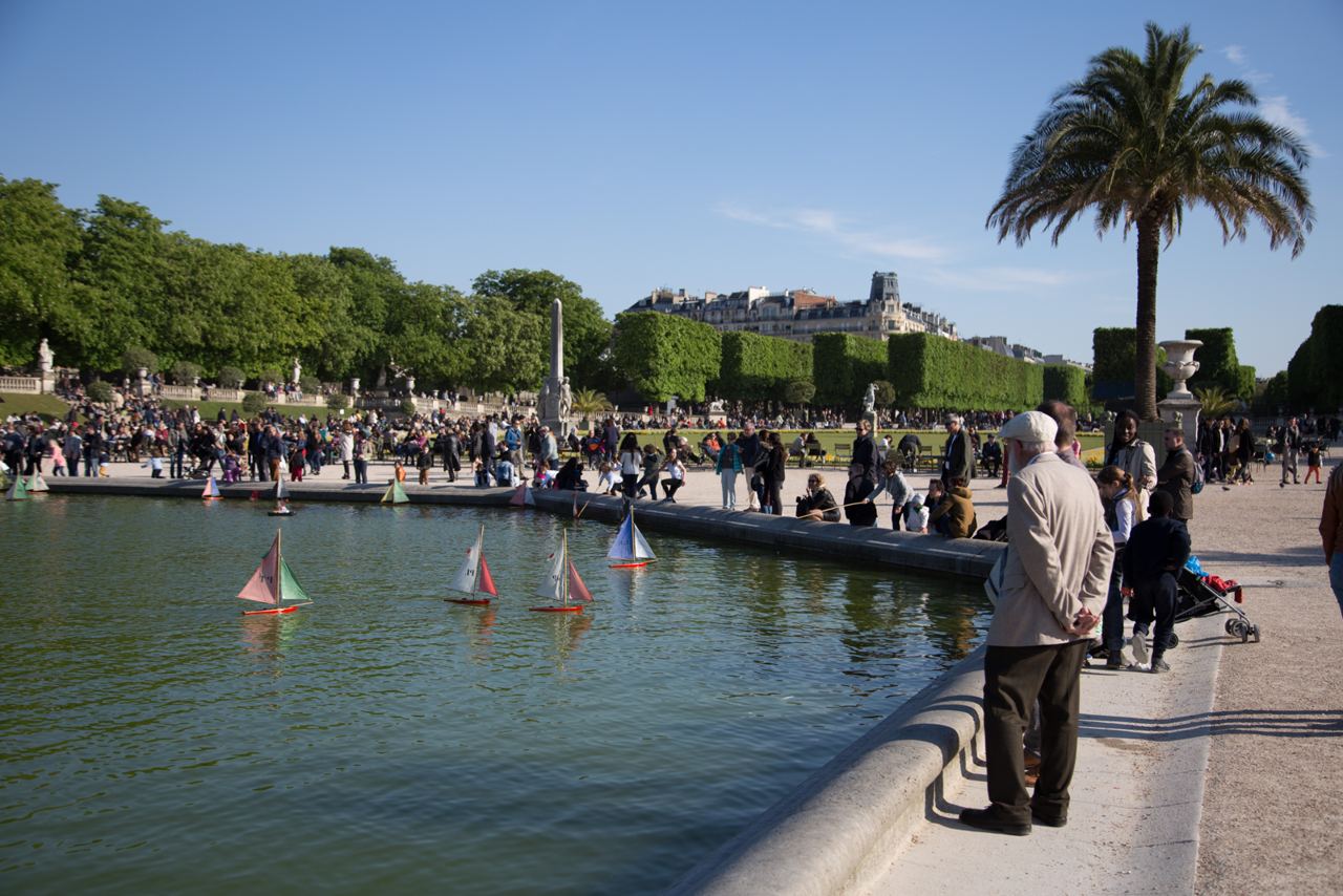 Toy sailboats on the grand bassin in the Jardin du Luxembourg, with the garden terraces behind