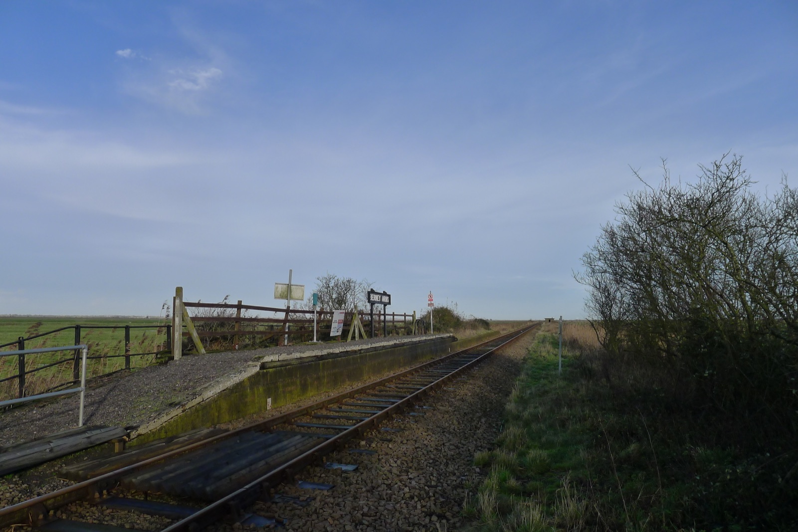 Berney Arms request stop on the Halvergate Marshes in Norfolk, with the drainage windmill beyond.