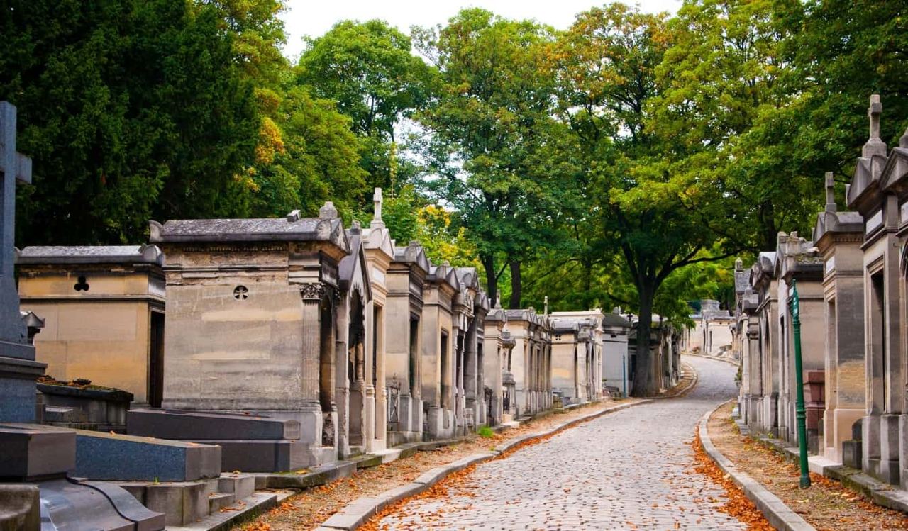 Pere Lachaise cemetery Paris tombs cobbled avenue trees