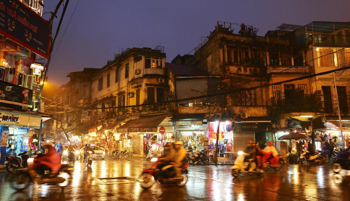 Hanoi Old Quarter wet pavement evening