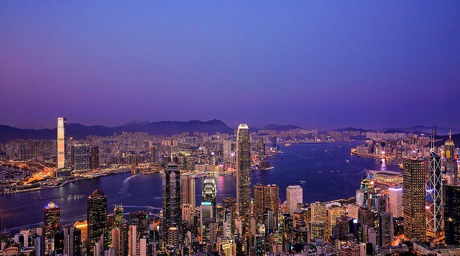 The Hong Kong skyline and Victoria Harbour at dusk, seen from Victoria Peak