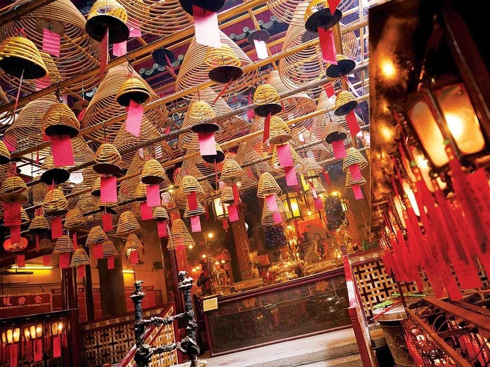 Hanging incense coils filling the ceiling inside Man Mo Temple