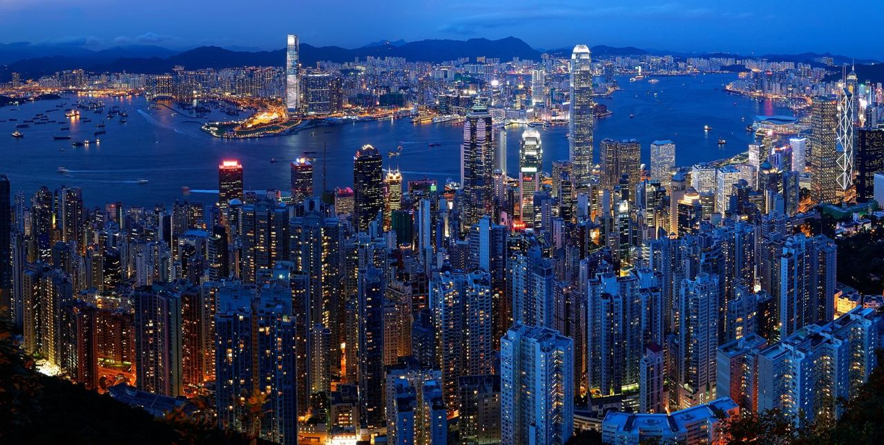 The Hong Kong skyline and Victoria Harbour at dusk seen from Victoria Peak